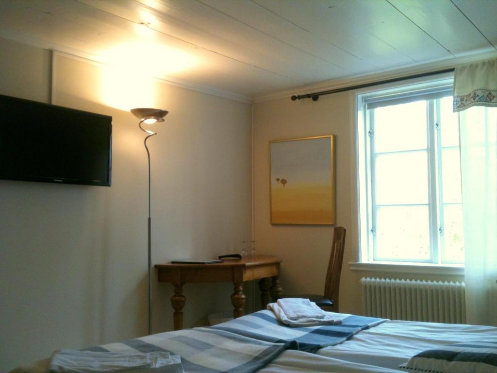 Postel nebo postele na pokoji v ubytování Allégården Kastlösa Hotell