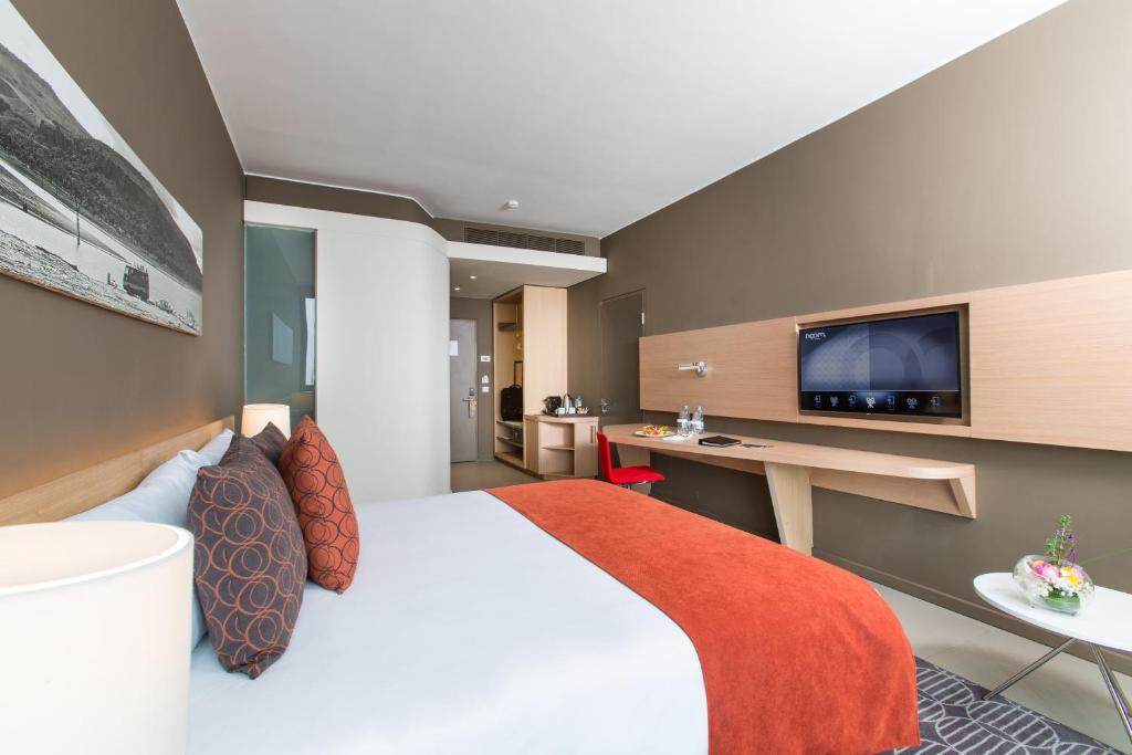 TV a/nebo společenská místnost v ubytování Noom Hotel Conakry