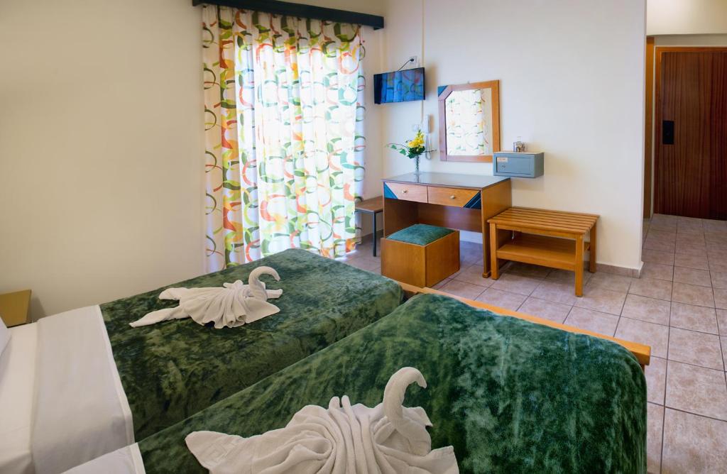 Postel nebo postele na pokoji v ubytování Nicolas Hotel