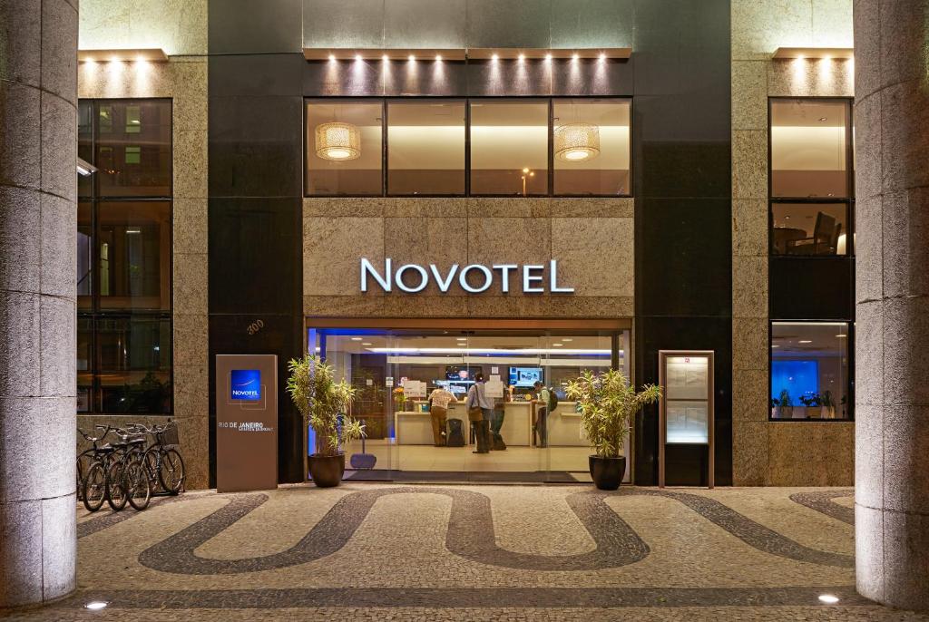 a large building with a sign on the side of it at Novotel RJ Santos Dumont in Rio de Janeiro