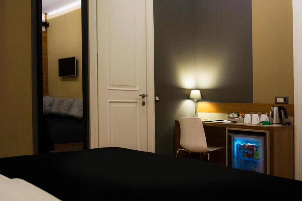 Postel nebo postele na pokoji v ubytování B&B Wimbledon Garni Concept