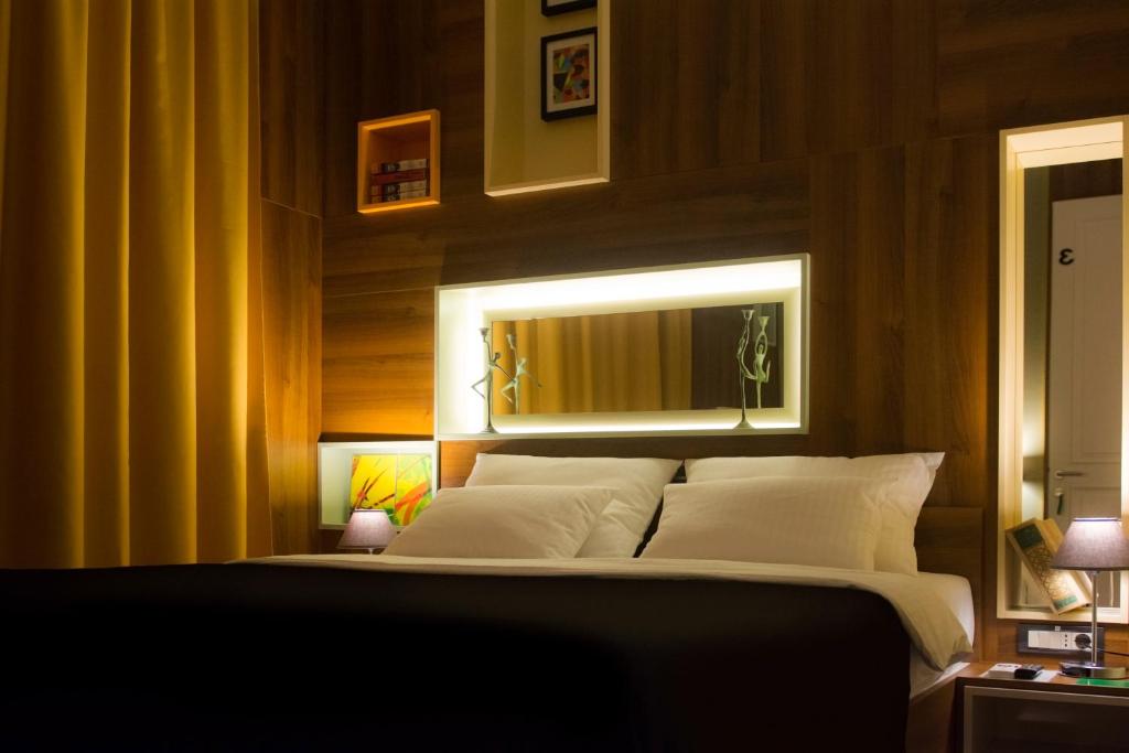 Postel nebo postele na pokoji v ubytování B&B Wimbledon Garni Concept