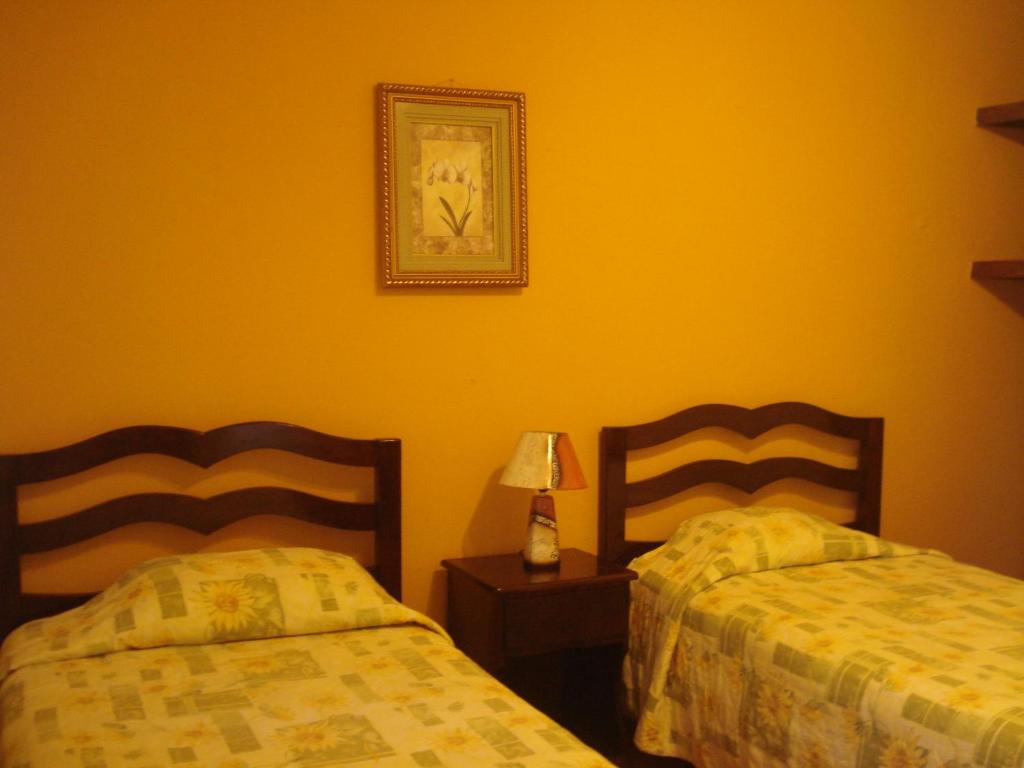 Postel nebo postele na pokoji v ubytování Hotel Brisas de Copan