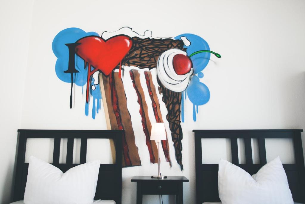 Postel nebo postele na pokoji v ubytování StayInn Hostel und Gästehaus