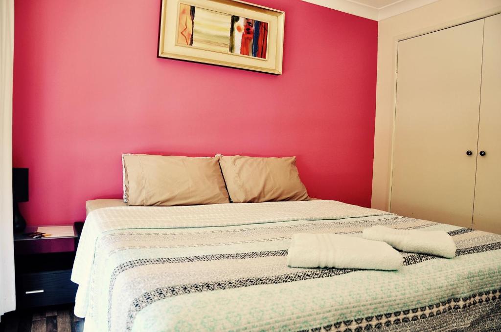 Postel nebo postele na pokoji v ubytování TL Warmest Homestay