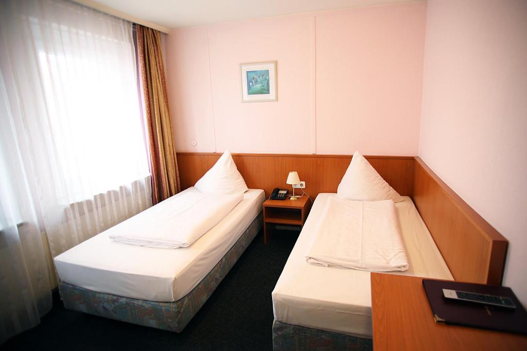 Voodi või voodid majutusasutuse Hotel Lafayette toas