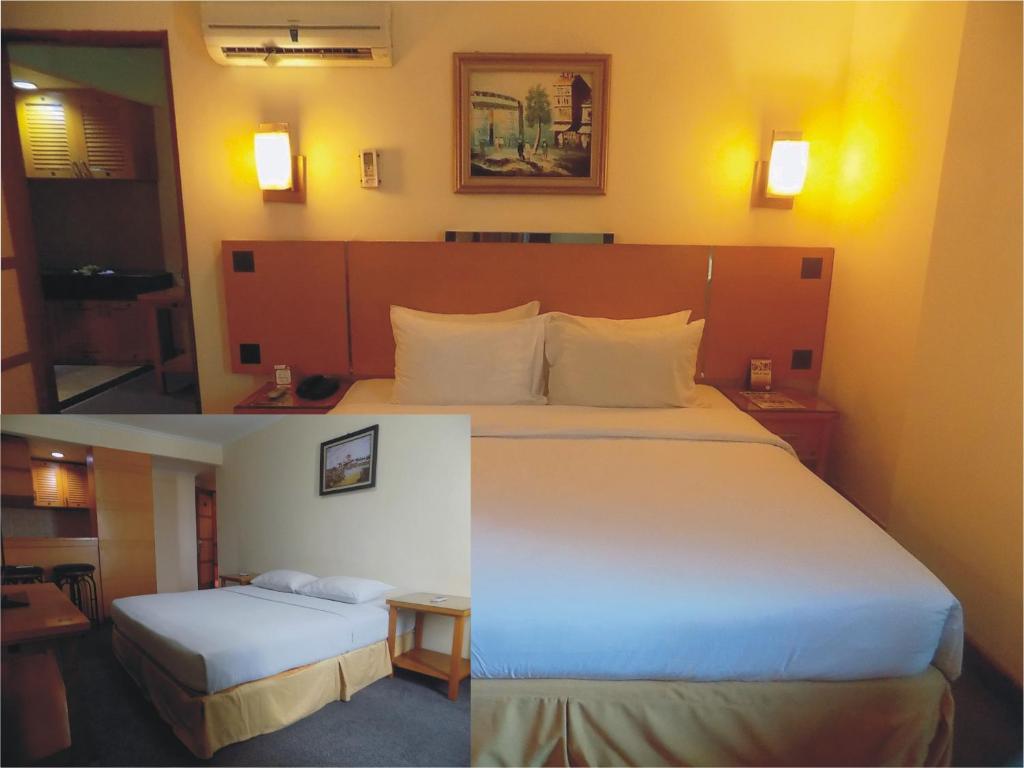 Tempat tidur dalam kamar di Mega Anggrek Hotel Jakarta Slipi
