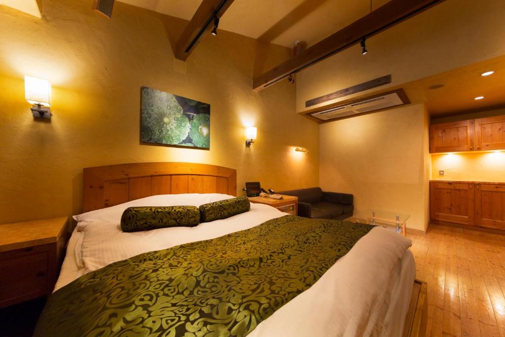 Postel nebo postele na pokoji v ubytování Hotel Lotus Nara (Adult Only)