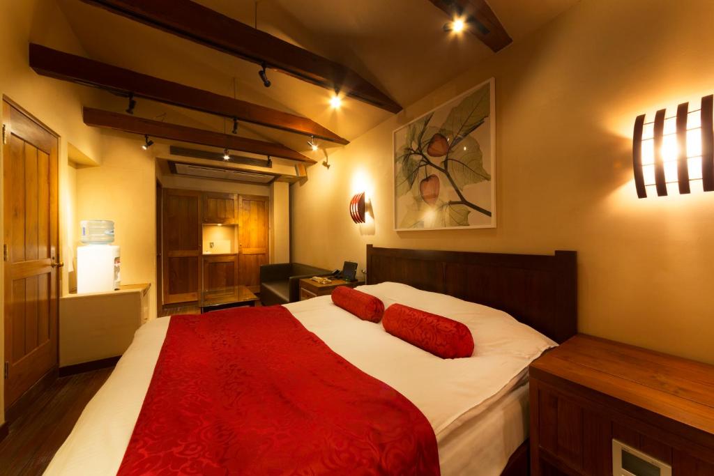 Postel nebo postele na pokoji v ubytování Hotel Lotus Nara (Adult Only)