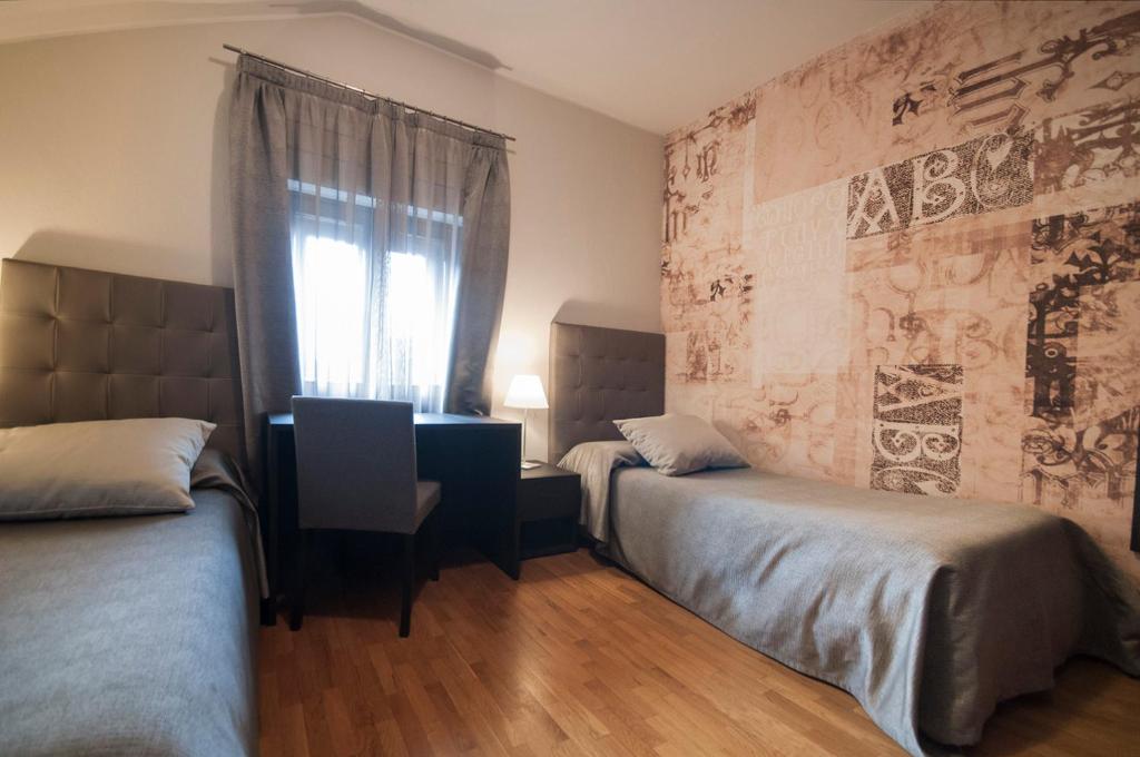 Postel nebo postele na pokoji v ubytování Hotel Maloia