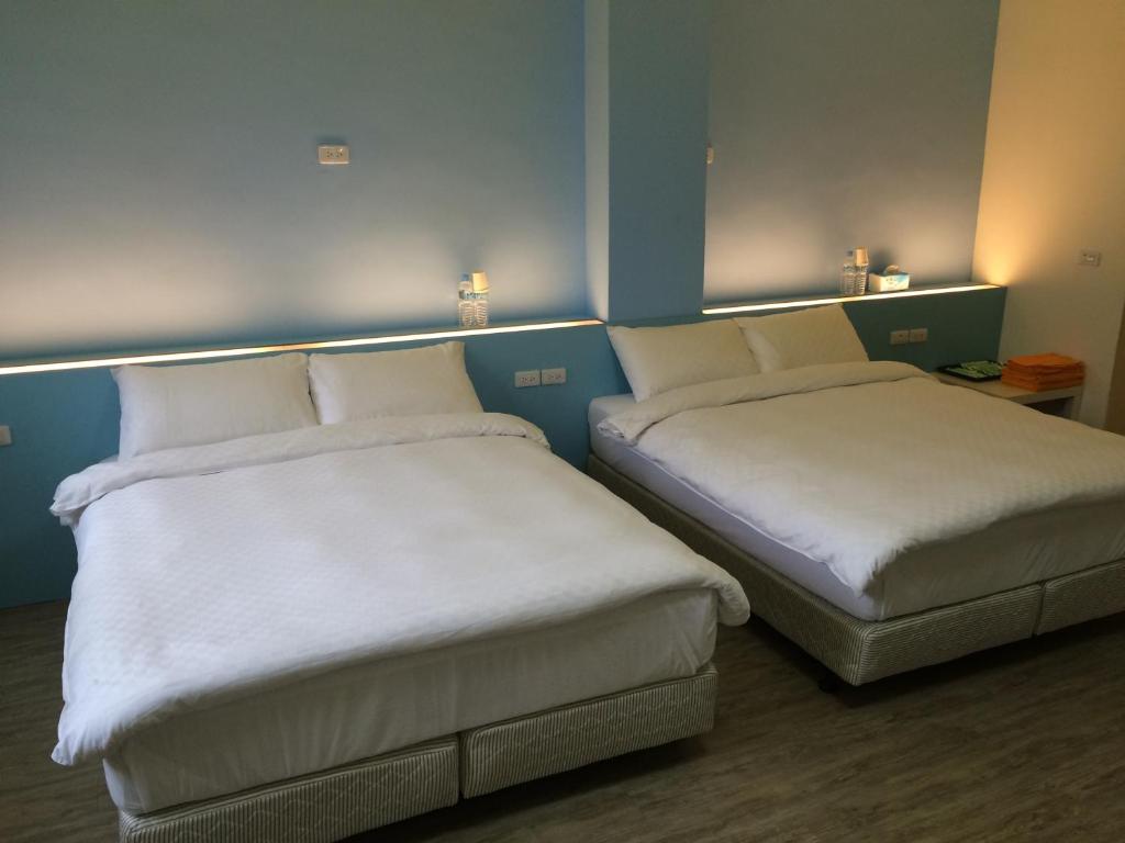 Postel nebo postele na pokoji v ubytování Taimali Hotel