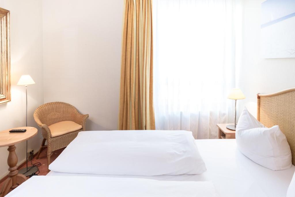 Postel nebo postele na pokoji v ubytování Hotel Leipzig City Nord by Campanile