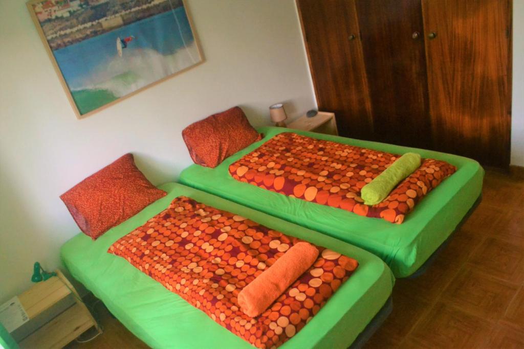 Postel nebo postele na pokoji v ubytování Surf House Peniche