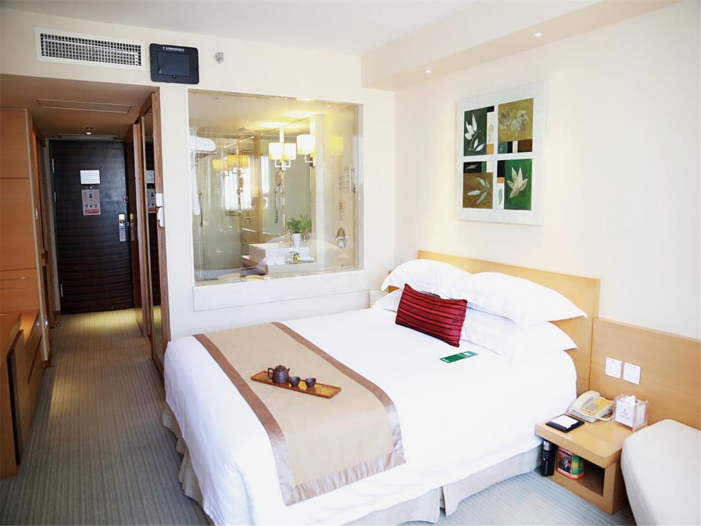 Postel nebo postele na pokoji v ubytování Jinglun Hotel Beijing