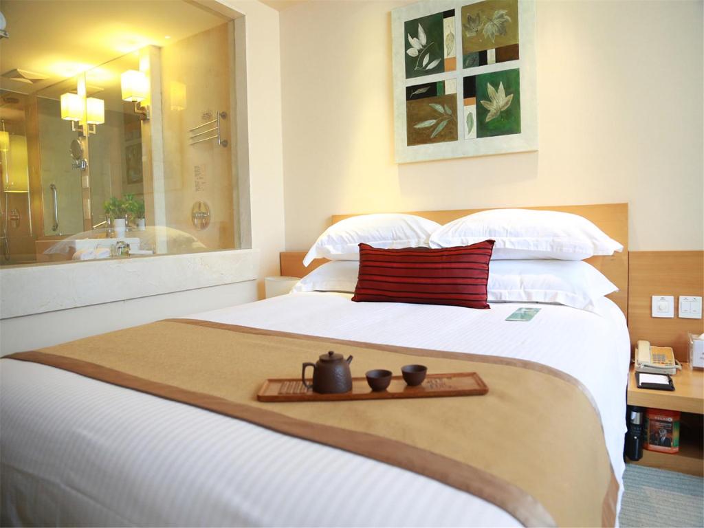 Postel nebo postele na pokoji v ubytování Jinglun Hotel Beijing