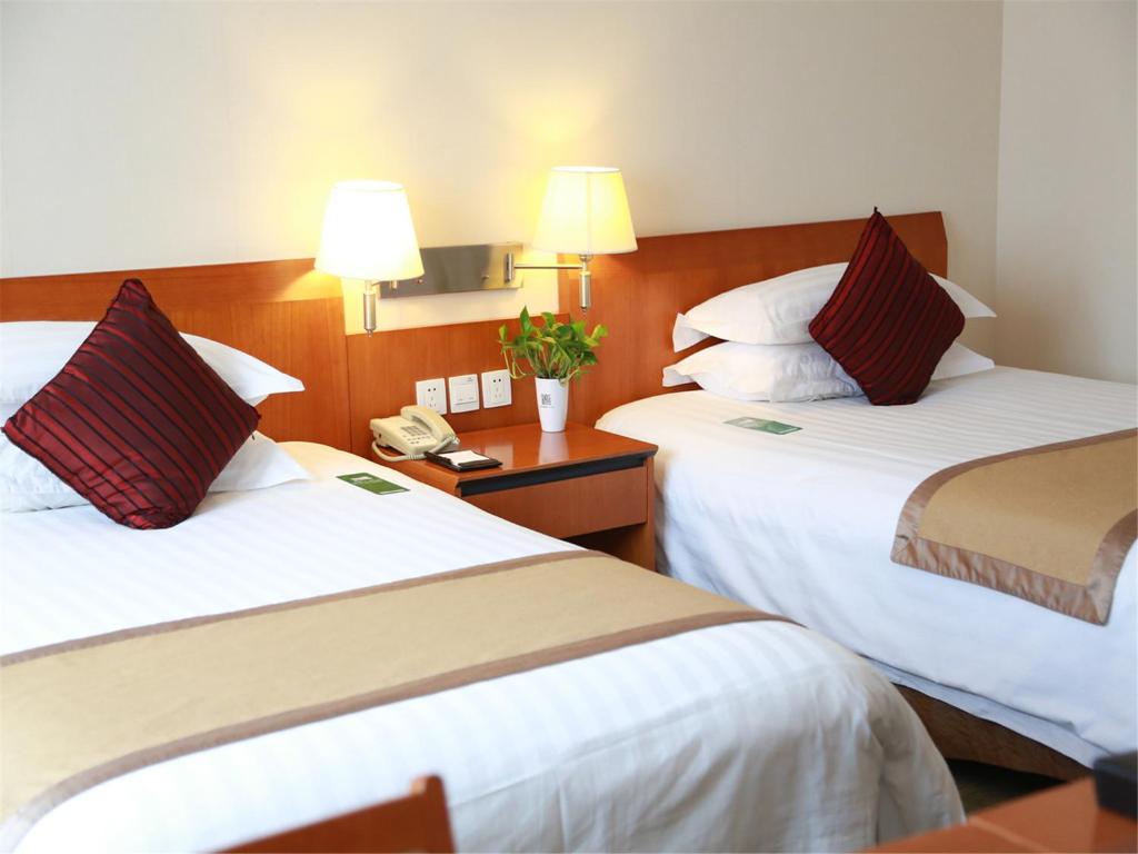 Postel nebo postele na pokoji v ubytování Jinglun Hotel Beijing