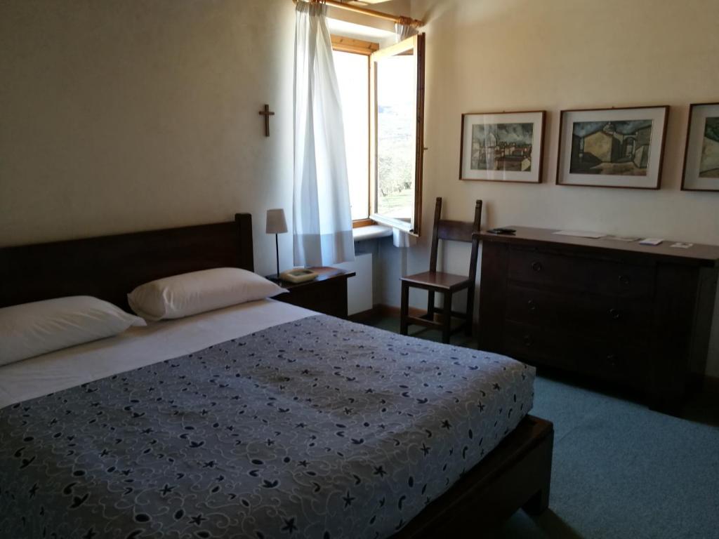Postel nebo postele na pokoji v ubytování Costa degli Ulivi