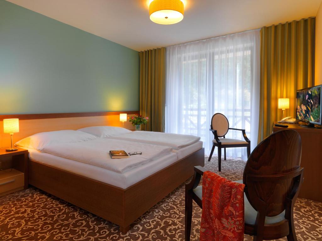 Postel nebo postele na pokoji v ubytování Hotel Green
