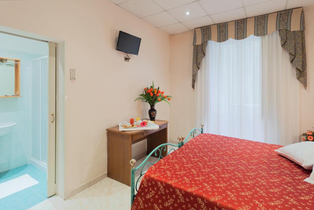 Postel nebo postele na pokoji v ubytování Hotel Oriente