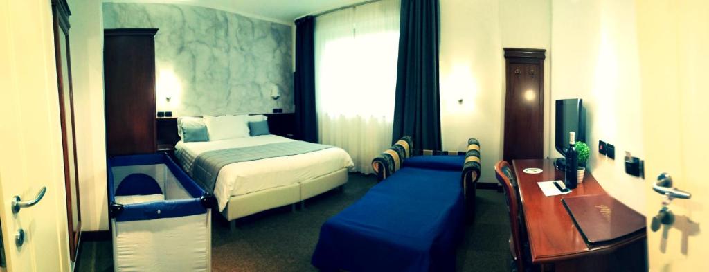 Postel nebo postele na pokoji v ubytování Hotel Medea