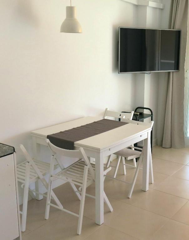 A television and/or entertainment centre at Magical Sea View Studios