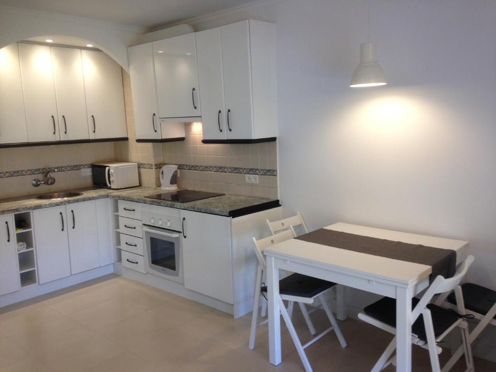A kitchen or kitchenette at Magical Sea View Studios