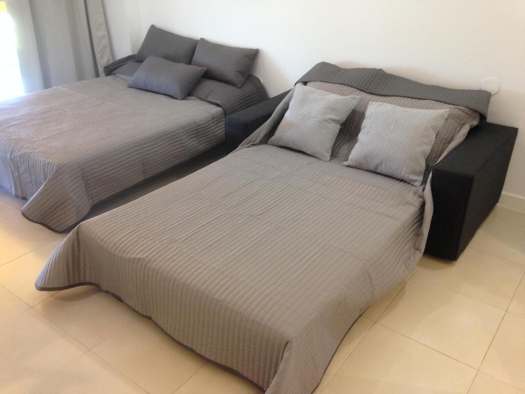 A bed or beds in a room at Magical Sea View Studios