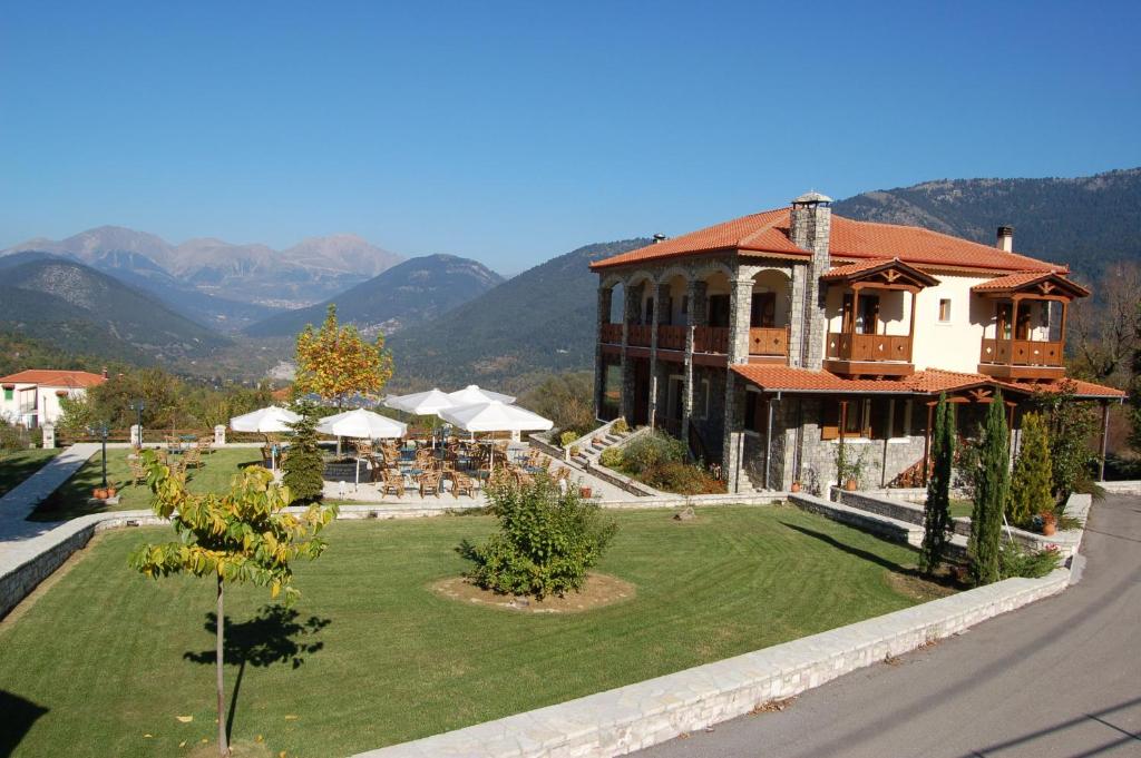 a large house with a lawn in front of it at Studio Merses in Mikrón Khoríon