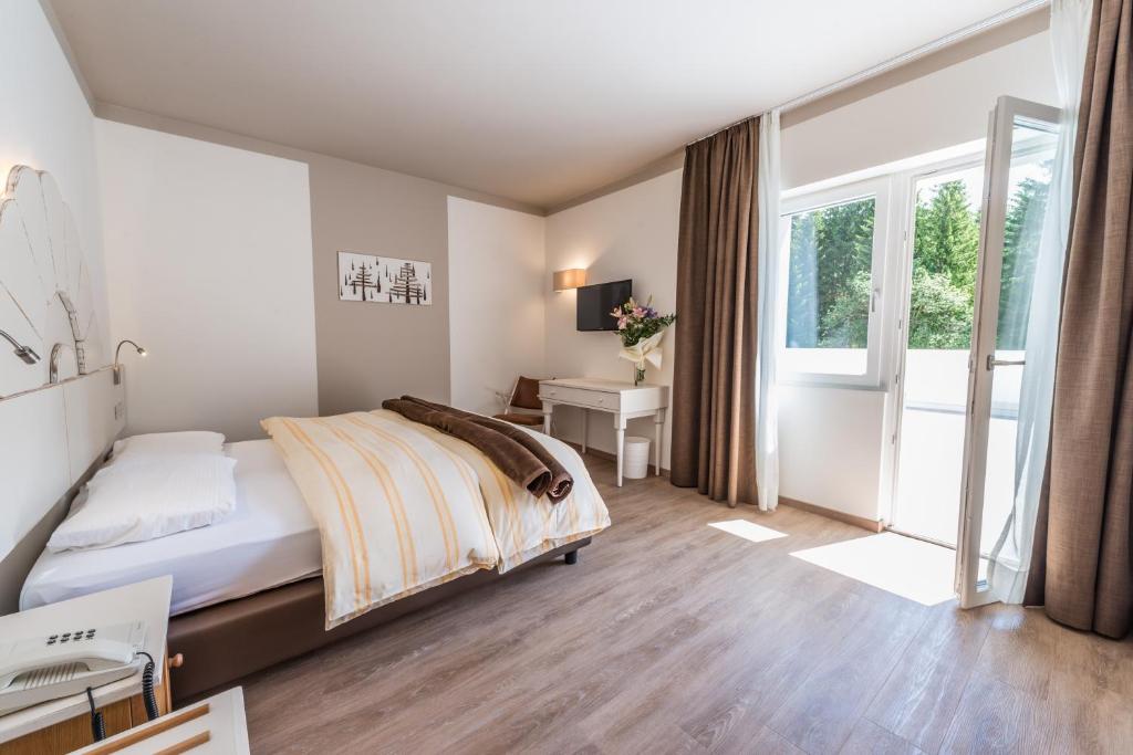 Postel nebo postele na pokoji v ubytování Hotel Paradiso
