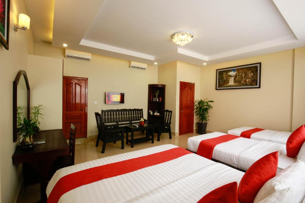 Postel nebo postele na pokoji v ubytování Chheng Residence