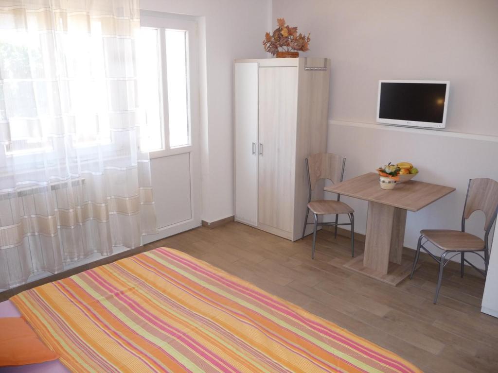 TV a/nebo společenská místnost v ubytování Apartments & Rooms Milka