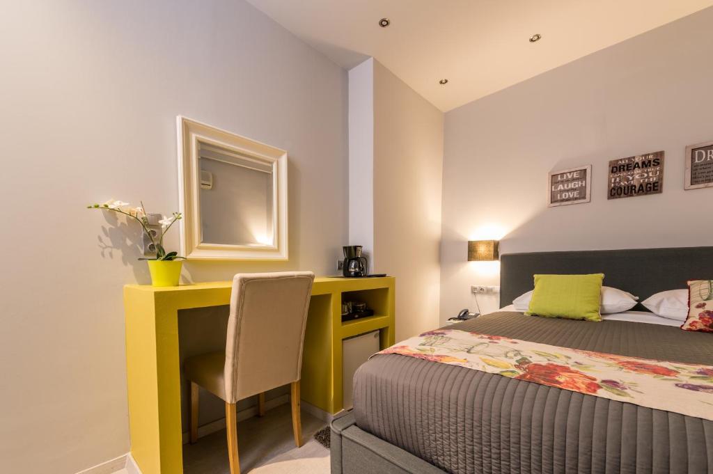 Postel nebo postele na pokoji v ubytování Filoxenia Hotel & Spa