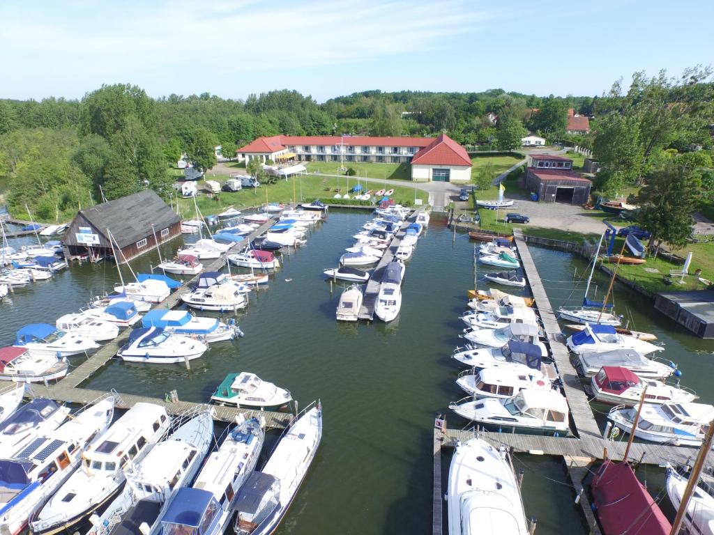 a bunch of boats are docked in a harbor at Aparthotel am Heidensee in Schwerin