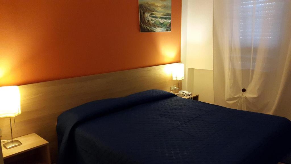Postel nebo postele na pokoji v ubytování Cavalieri del Tau