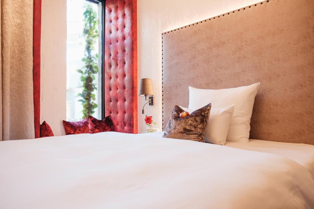 Postel nebo postele na pokoji v ubytování Eriks Hotel