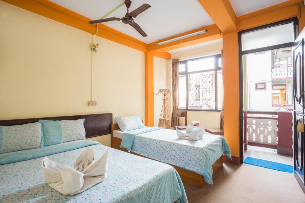 Postel nebo postele na pokoji v ubytování Hotel Yala Peak