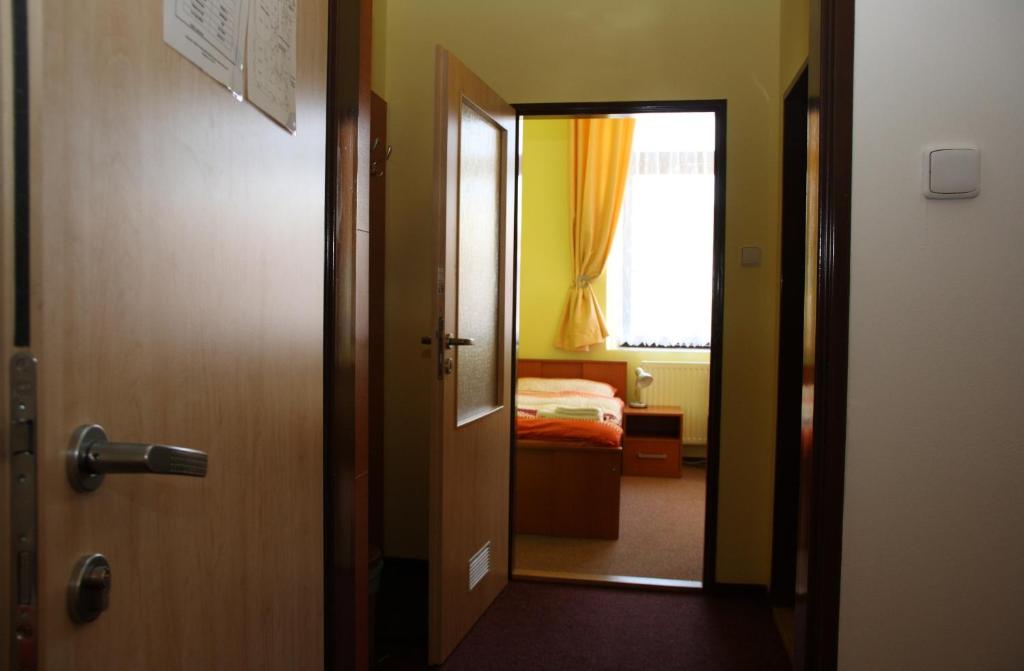 Postel nebo postele na pokoji v ubytování Penzion Česká Koruna