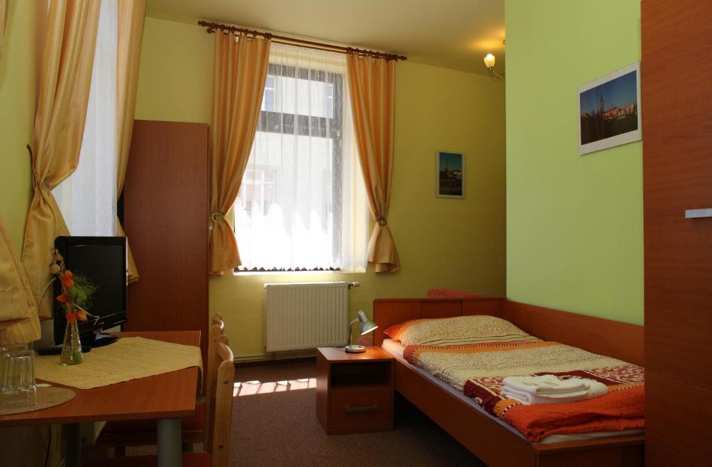 Postel nebo postele na pokoji v ubytování Penzion Česká Koruna