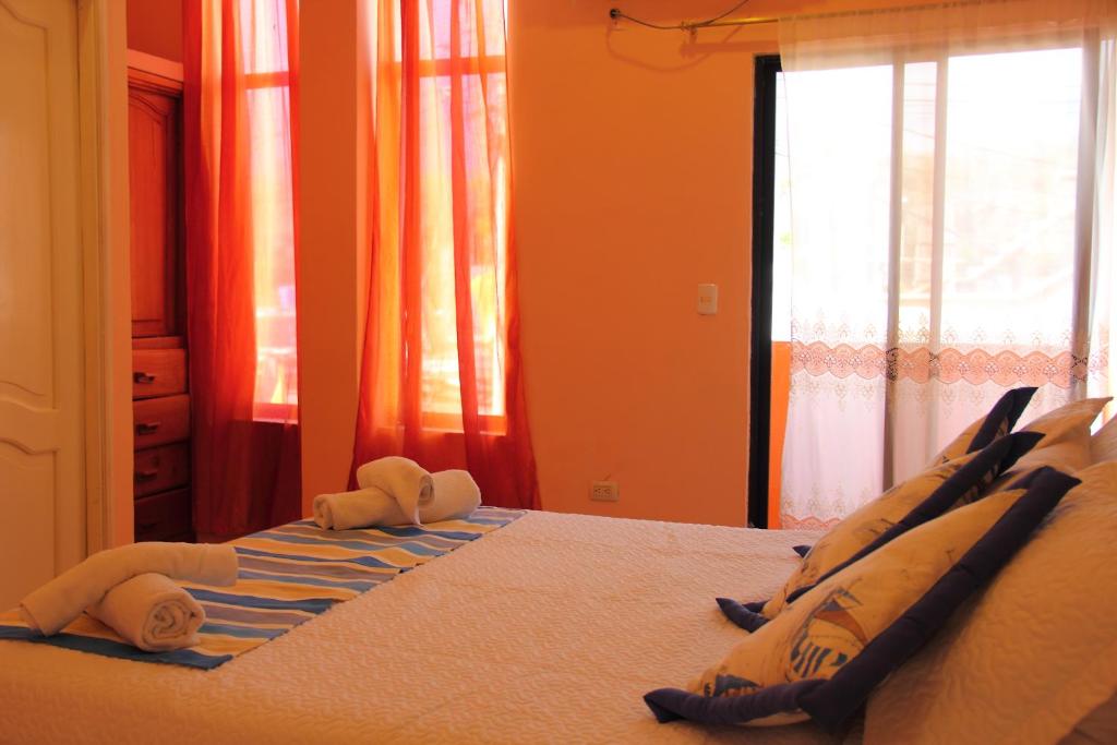 Postel nebo postele na pokoji v ubytování Hostal Duncan