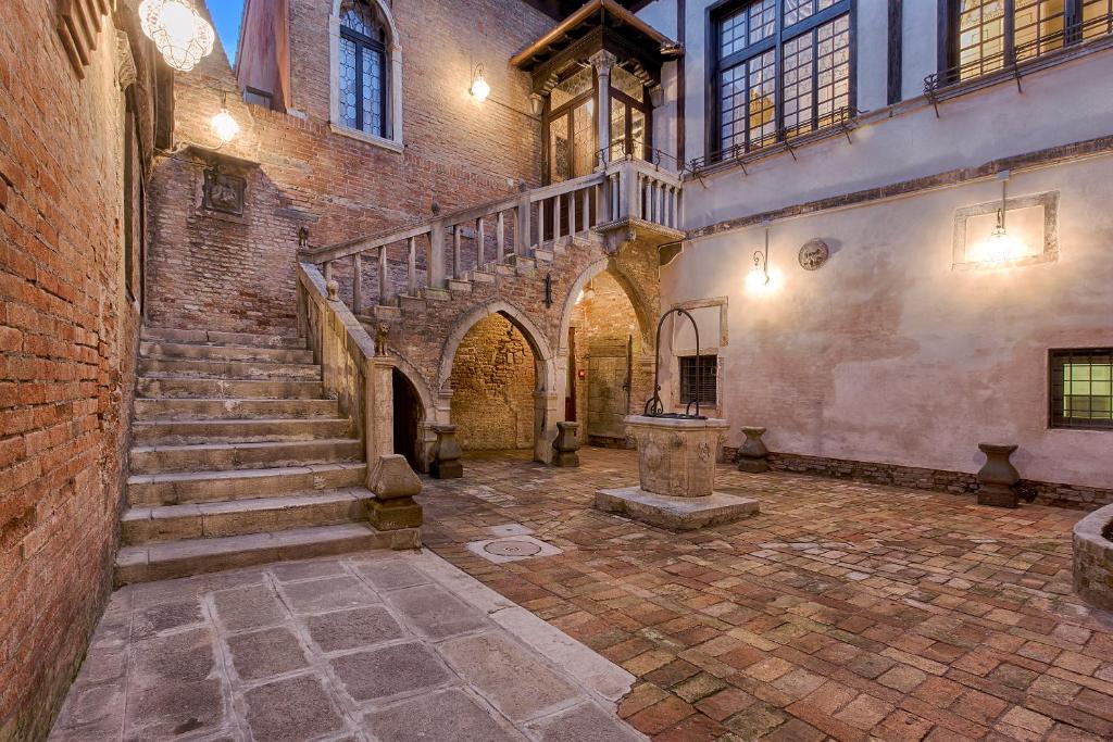 an old brick building with stairs and a stair case at Hotel Ca' Nobile Corner in Venice