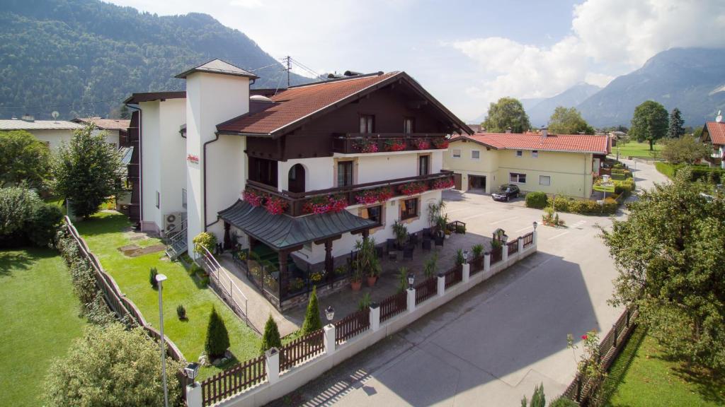 an aerial view of a house with a fence at Gasthof Pension Alpenblick in Radfeld