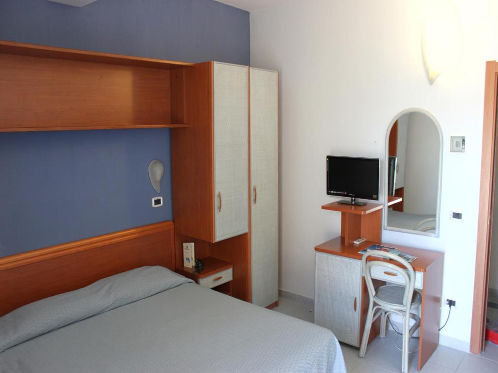 Postel nebo postele na pokoji v ubytování Hotel Acquario