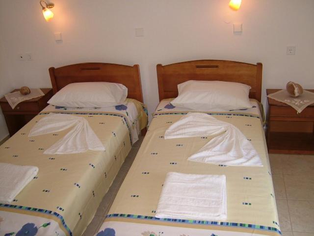 Postel nebo postele na pokoji v ubytování Estelle Hotel