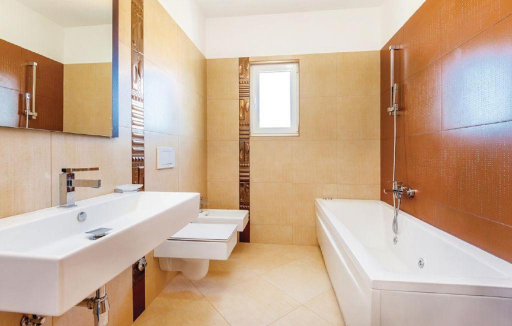 Kúpeľňa v ubytovaní Apartments Host