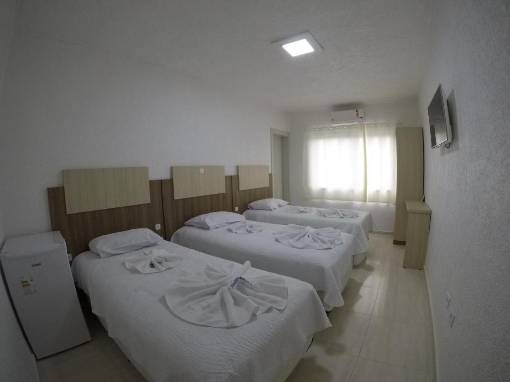 Postel nebo postele na pokoji v ubytování Hotel Dove
