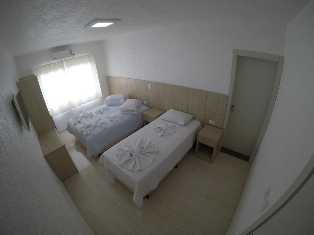 Postel nebo postele na pokoji v ubytování Hotel Dove