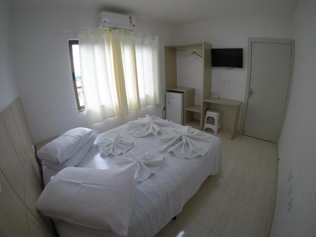 Postel nebo postele na pokoji v ubytování Hotel Dove