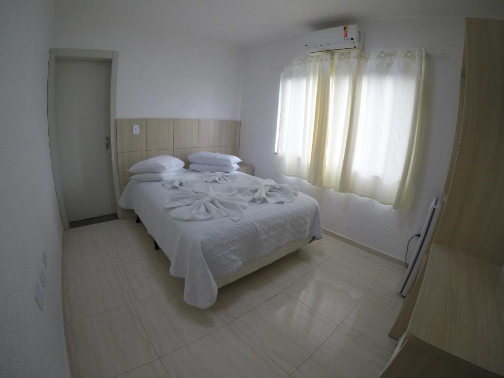 Postel nebo postele na pokoji v ubytování Hotel Dove