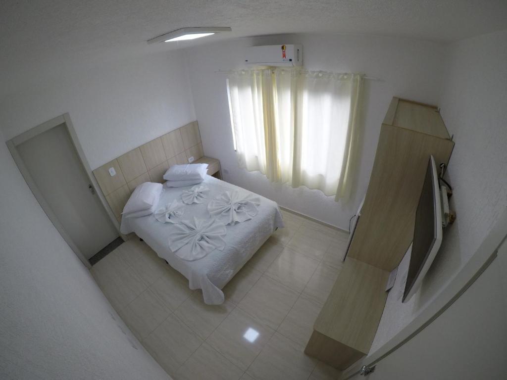 Postel nebo postele na pokoji v ubytování Hotel Dove