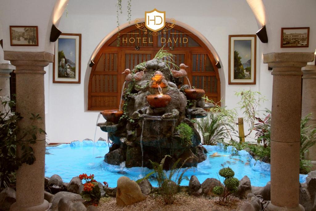 a water fountain in front of a hotel lobby at Hotel David in Quito